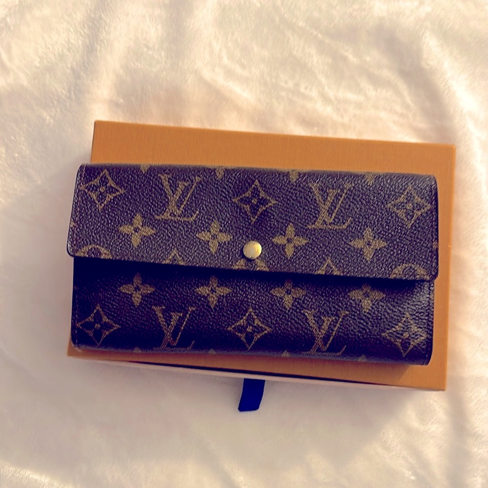 Louis Vuitton Wallet. Luxury item.